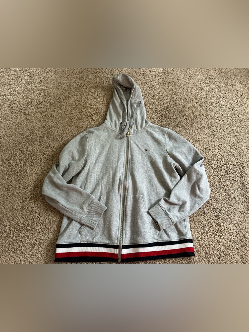 Tommy Hilfiger Light Gray Zip Hoodie with Signature Stripe Hem.